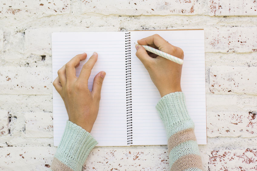 44105267 – girl writes in notebook